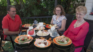 Friends sharing lunch in the garden at The Bohemian Tearoom