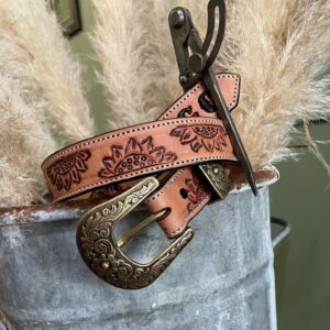 Hand-tooled leather belts with ornate buckles by Matilda Made Leather
