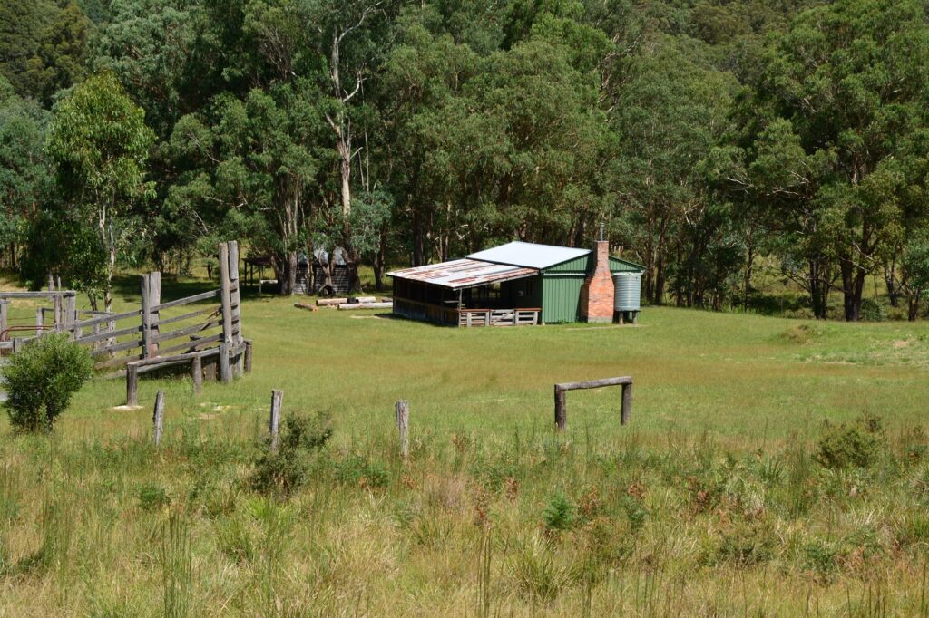 Four Bull Hut and stockyards on open grassland near Tenterfield