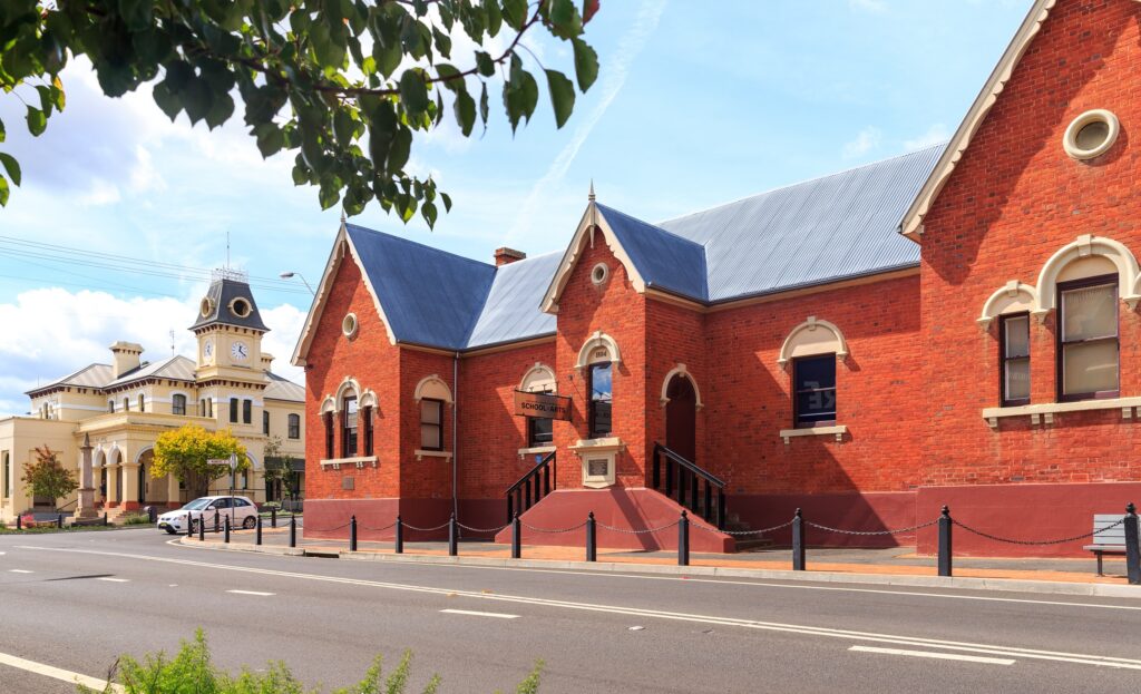 Street view of the red brick Sir Henry Parkes Memorial School of Arts on Rouse Street, Tenterfield