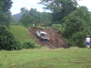 Four-wheel drive descending a steep dirt track at Levuka Rainforest Recreation Park