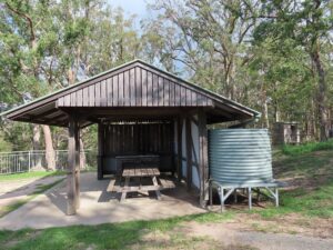 Covered picnic shelter with water tank at Mount Mackenzie Scenic Lookout