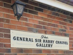 Brick wall sign for the General Sir Harry Chauvel Gallery at Centenary Cottage Museum