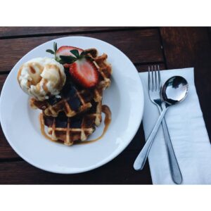 Waffles with ice cream and strawberries at The Courtyard Cafe