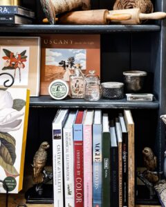 Shelf of books, prints and curios at Ruben & Flax Homewares