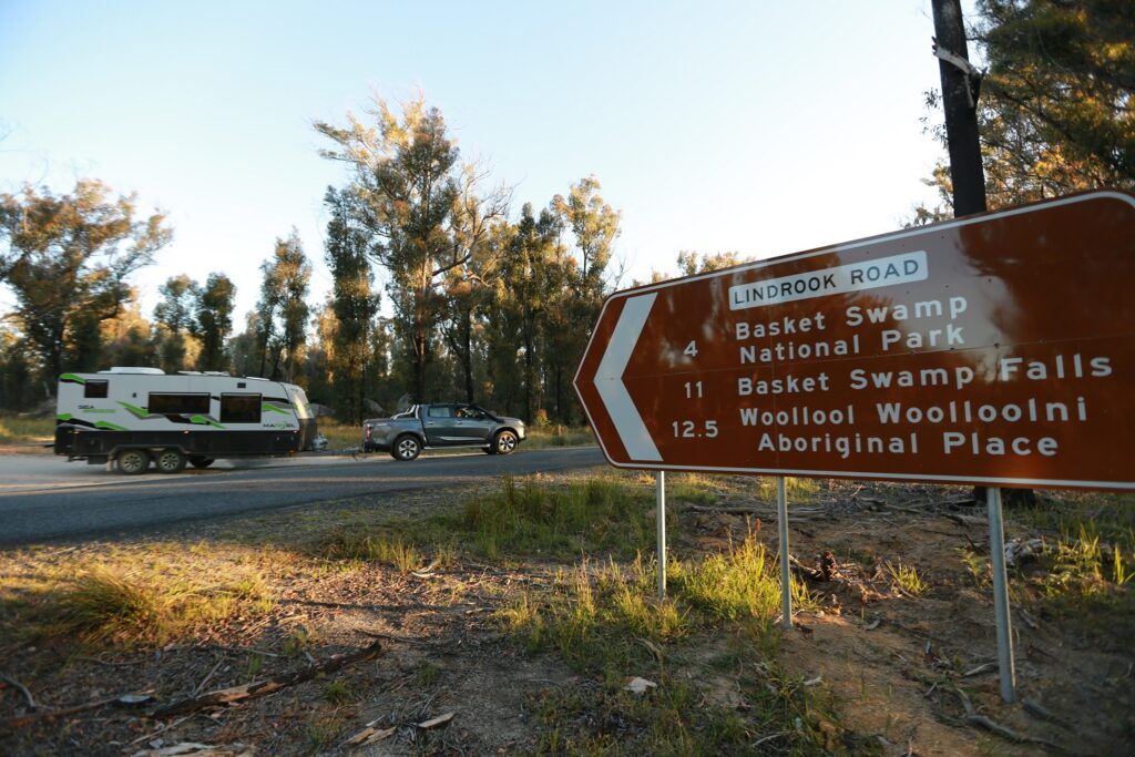 Road sign for Basket Swamp and Woolool Woollool Aboriginal Place near Mount Lindesay