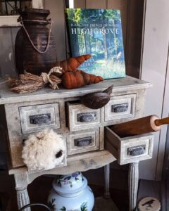 Rustic drawers styled with garden books and ornaments at Ruben & Flax