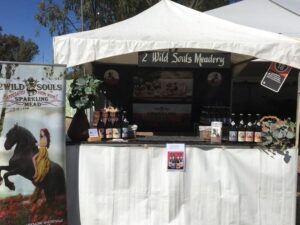 2 Wild Souls Meadery market stall with bottles and banners