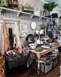 Country table setting of jugs, baskets and ceramics at Ruben & Flax