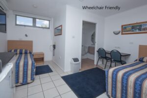 Wheelchair-friendly unit with accessible bathroom at the Tally Ho Motor Inn