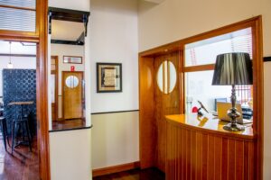 Reception window and hallway inside the art deco Commercial Boutique Hotel