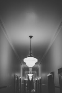 Pendant light in the hallway of The Commercial Boutique Hotel, in black and white