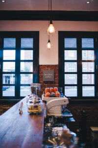 High table by blue French doors in The Commercial Boutique Hotel dining room