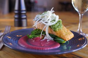 Crumbed fish on beetroot puree with shaved fennel at The Commercial restaurant