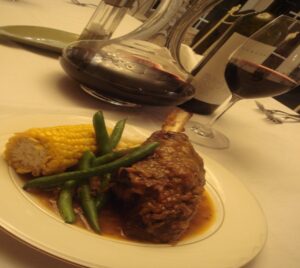Slow-cooked lamb shank dinner with red wine at Mistral Hill