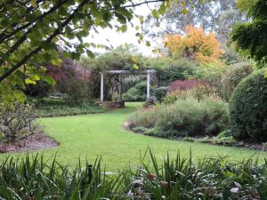 Rose arbour and manicured lawns at Glenrock Gardens