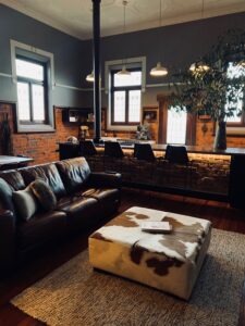 Leather lounge and cowhide ottoman in the Old Council Chambers retreat