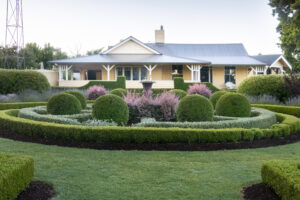 Formal circular garden beds in front of the Ivy Leaf Chapel guesthouse