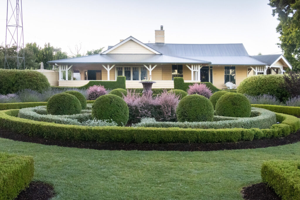 Formal circular garden beds in front of the Ivy Leaf Chapel guesthouse