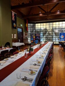 Long table set for a formal dinner in the hall of the School of Arts, Tenterfield