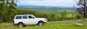 Four-wheel drive on a hilltop overlooking the ranges at Cullendore High Country