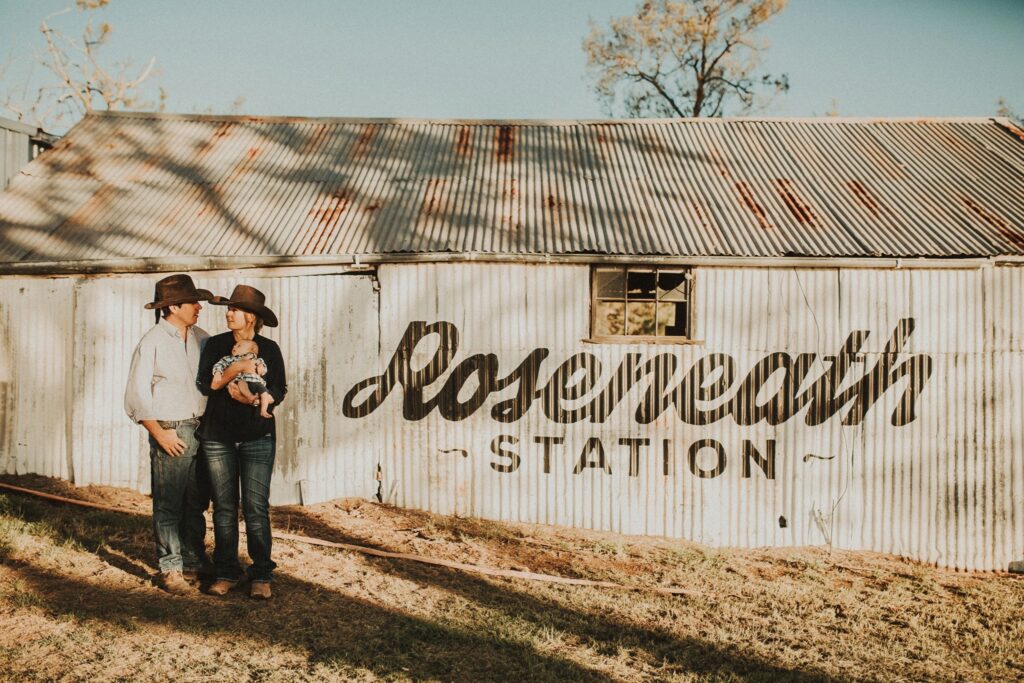 Couple with their dogs by the Roseneath Station corrugated iron shearing shed
