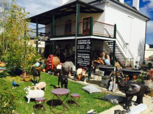 Antiques and collectables displayed outside the two-storey Margot Rees Antiques store