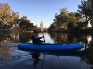 Kayaking on the calm Dumaresq River at Roseneath Station Farm Stay