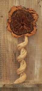 Timber wall sculpture of a flower by Michael Pieper