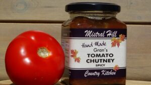 Jar of Gran's spicy tomato chutney with fresh tomato, Mistral Hill Country Kitchen