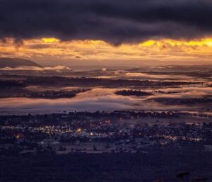 Dawn light over mist-covered Tenterfield from Mount Mackenzie, photo by Ken Ware