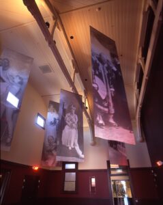 Historic photograph banners hanging in the foyer of the Sir Henry Parkes Memorial School of Arts