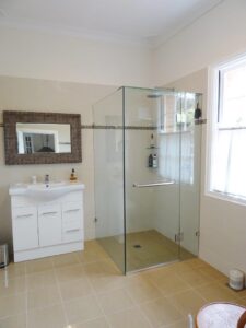 Glass shower and vanity in the Red Rose Cottage bathroom