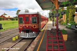 Restored red rail motor at the platform of Tenterfield Railway Museum