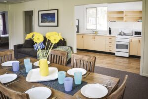 Dining table and kitchen inside Robinsons Cabin