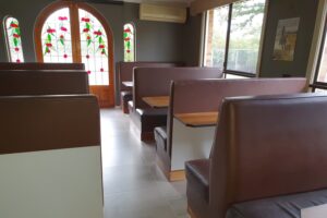 Booth seating in the dining room at the Tally Ho Motor Inn