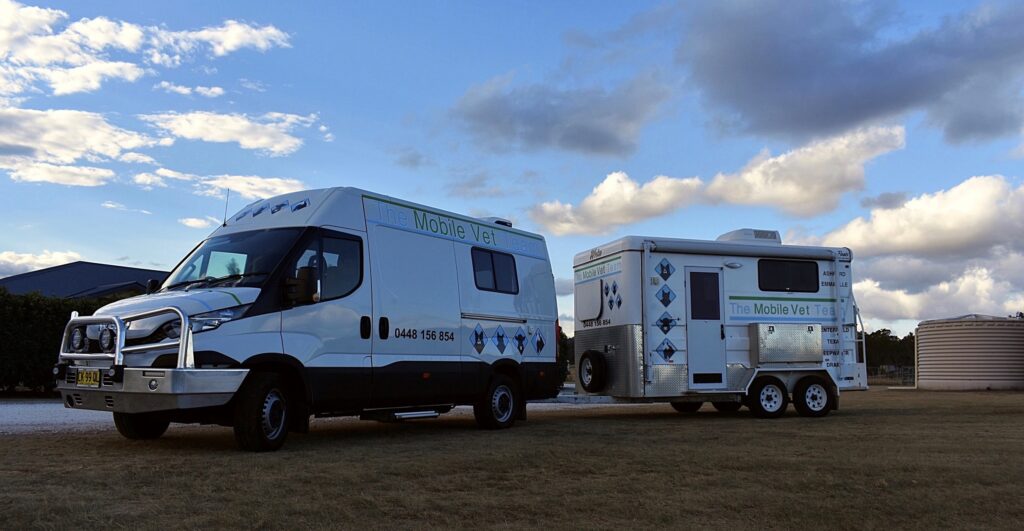 The Mobile Vet Team van towing its caravan clinic