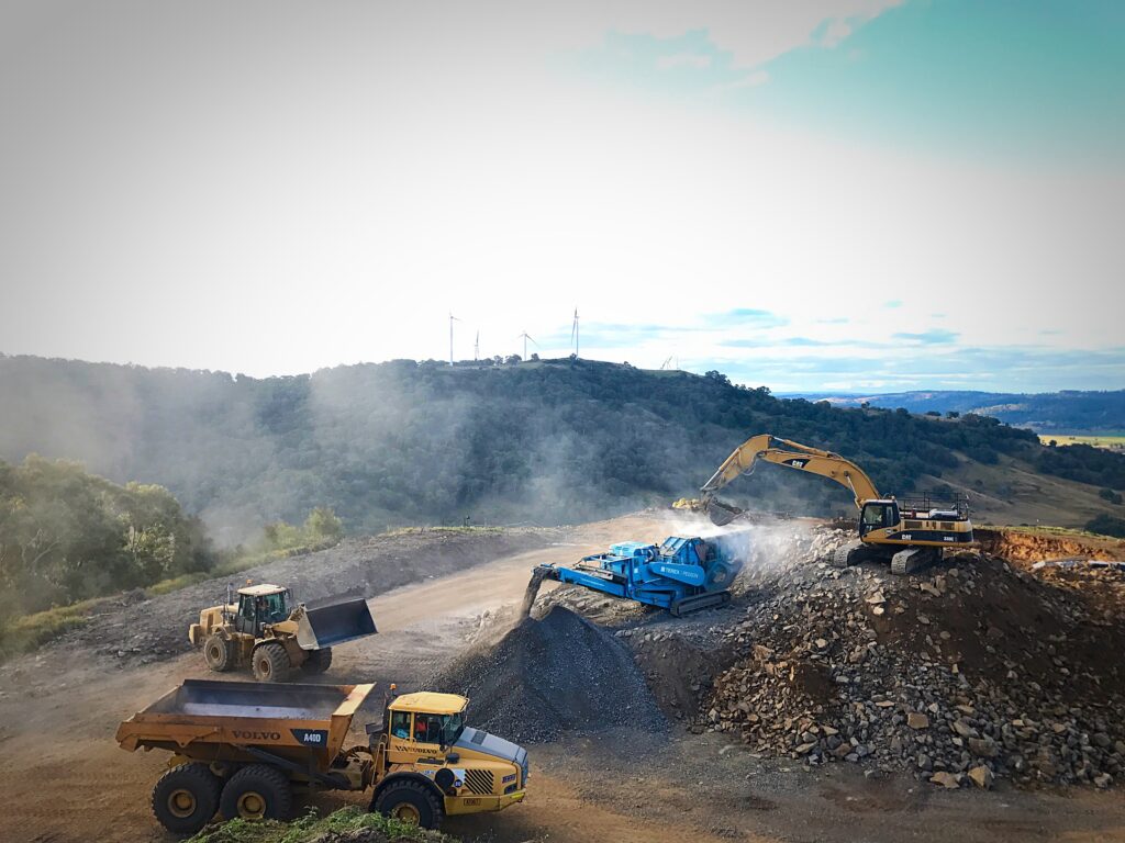 Excavators and trucks working a quarry site, Townes Contracting Group