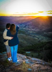 Couple watching the sunset over the valley at Wangrah Wilderness Lodge