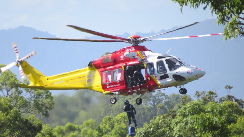 Westpac Rescue Helicopter hovering with crewman at the door