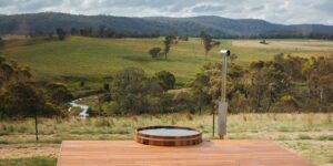 Wood-fired hot tub on the deck at Gabarraa overlooking the valley