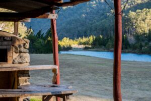 View of the river and hills from the outdoor kitchen at Clarence River Wilderness Lodge