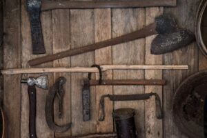 Vintage hand tools displayed on a timber wall at Clarence River Wilderness Lodge