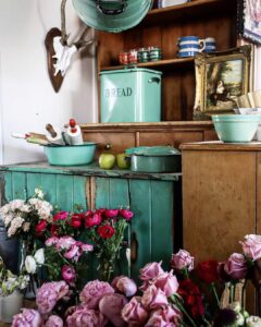 Vintage green dresser with peonies and enamelware at White Cottage Flower Farm