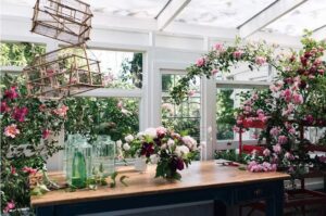 Conservatory workshop space wrapped in roses at White Cottage Flower Farm