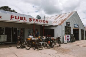 Cyclists resupplying at the Emmaville fuel station on the Deepwater Loop