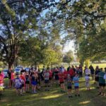 Runners gathering under the trees for Park Run Tenterfield