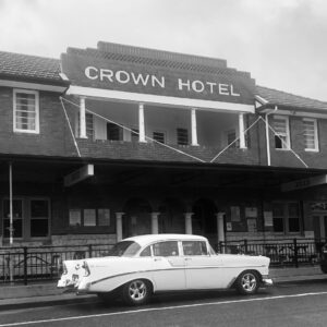 Historic black and white photo of the Crown Hotel Urbenville with a 1950s car out front