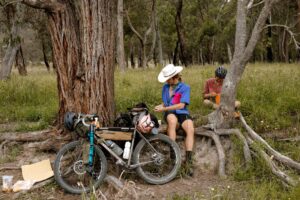 Riders taking a break under a big gum on the Tenterfield–Bolivia–Torrington overnighter