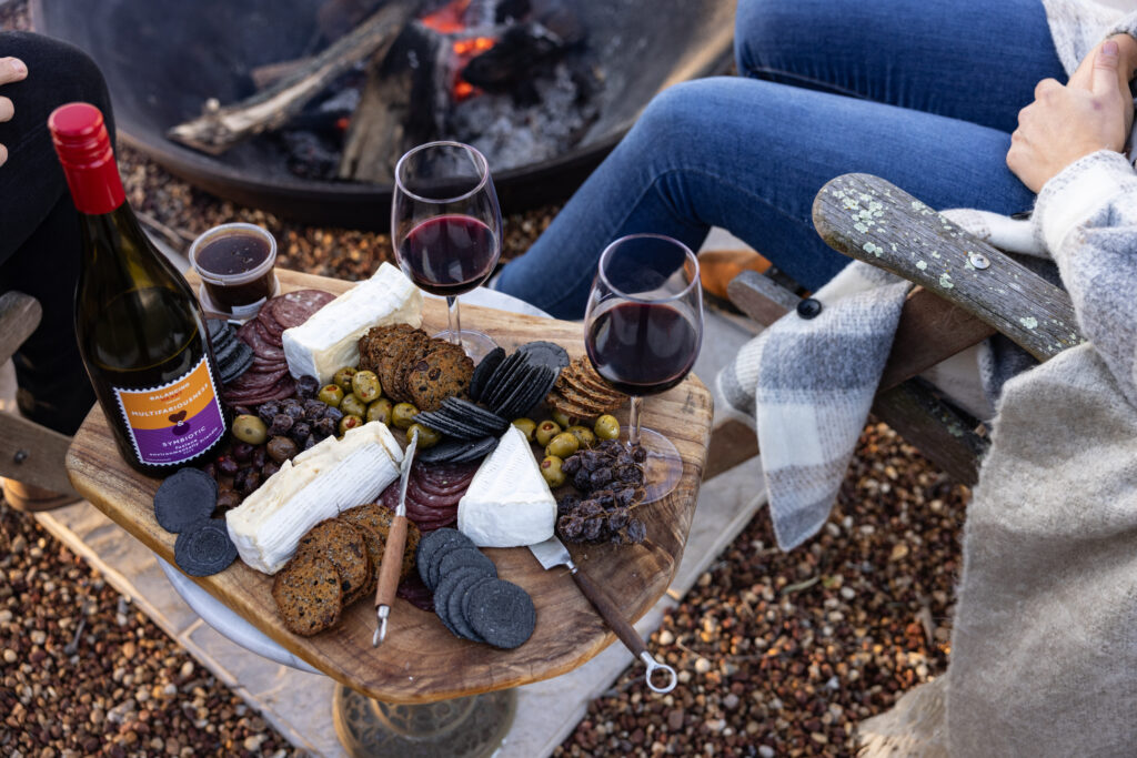 Fireside picnic of wine, cheese and toasted marshmallows in Tenterfield